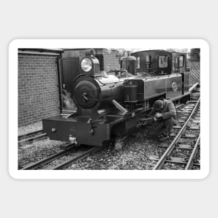 Engineer tending to a steam train Sticker